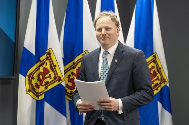 Finance and Treasury Board Minister Allan MacMaster arrives at a press conference before tabling the provincial budget at the Nova Scotia legislature in Halifax on Thursday, Feb. 29, 2024. THE CANADIAN PRESS/Darren Calabrese