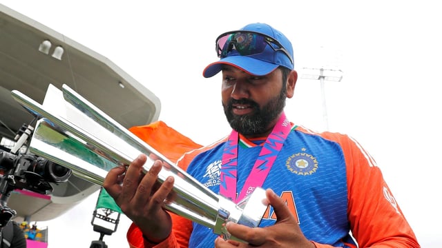 Rohit Sharma poses for a picture with the trophy after Team India won the ICC Mens T20 World Cup 2024 