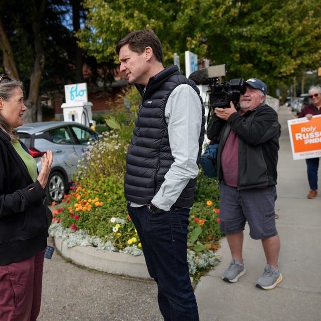 B.C. NDP Leader David Eby listens to a resident during a campaign stop, in Grand Forks, B.C., Tuesday, Oct. 1, 2024. THE CANADIAN PRESS/Darryl Dyck