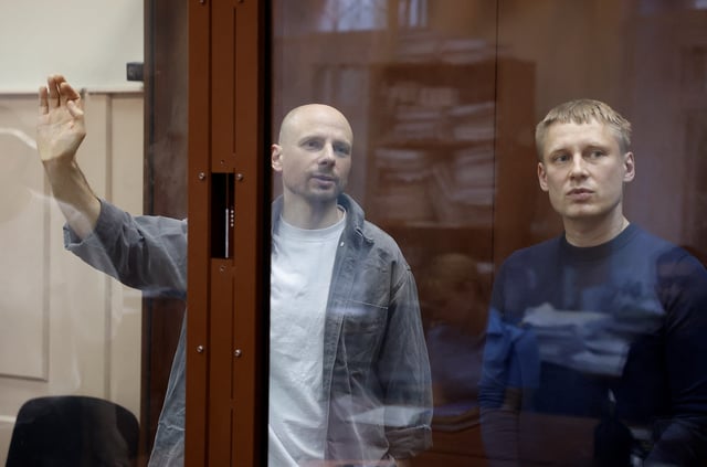 Konstantin Gabov, a freelance journalist who in the past worked for Reuters, and Sergei Karelin, who in the past worked for the Associated Press, accused of taking part in the activities of an "extremist" organization founded by late opposition politician Alexei Navalny, attend a hearing of the court considering extending their pre-trial detention in Moscow, Russia June 25, 2024. REUTERS/Yulia Morozova/File Photo