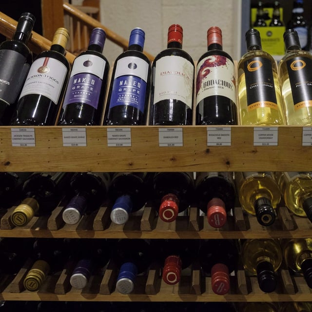 Albertans won't be able to buy alcohol from grocery and convenience stores after all. Bottles of wine are shown on display at a liquor store in Cremona, Alta. on Wednesday, Feb. 7, 2018. THE CANADIAN PRESS/Jeff McIntosh