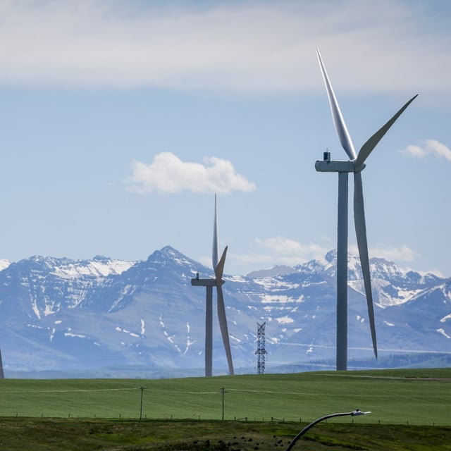 Market experts say the coming boom in artificial intelligence has the potential to spur large-scale investments in clean energy. Wind turbines are seen with the Rocky Mountains in the background near Pincher Creek, Alta., Thursday, June 6, 2024. THE CANADIAN PRESS/Jeff McIntosh