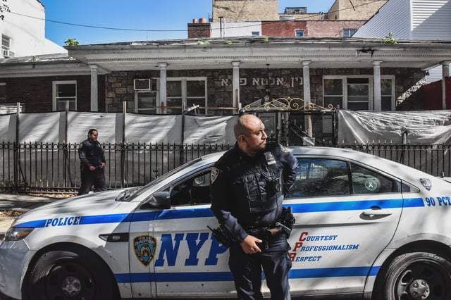Members of the New York Police Department patrol in front of a synagogue on Oct. 13, 2023 in the Williamsburg neighborhood of Brooklyn.