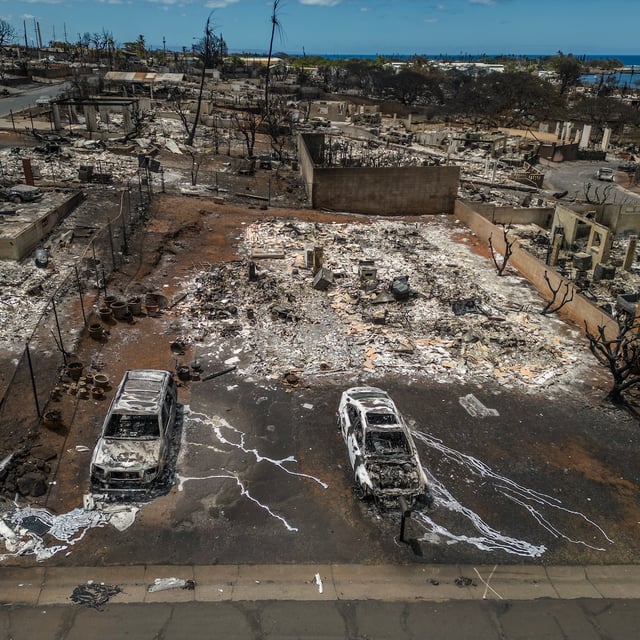 FILE — A burned building and cars in Lahaina, on the Hawaiian island of Maui, Aug. 16, 2023. Hawaii’s attorney general released the latest findings on the 2023 fire that destroyed much of the town of Lahaina, finding a range of shortcomings in the response. (Go Nakamura/The New York Times)