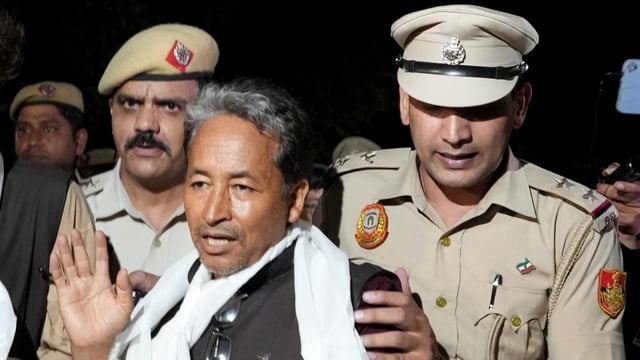 Climate activist Sonam Wangchuk being taken by police personnel after he along with other Ladakhis, was brought to Rajghat on Gandhi Jayanti, in New Delhi.