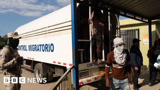 Haitian migrants seen at the back of a lorry belonging to the immigration enforcement service of the Dominican Republic