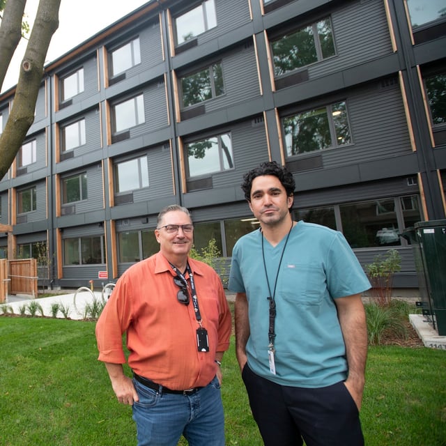 Keith Hambly (L) CEO of Fred Victor Housing, and Dr. Andrew Boozary, Executive Director, Social Medicine for the UHN, are  photographed outside a new supportive housing development on Oct 1, 2024. 51 units were built on land donated by UHN and the residential building will be operated by the Fred Victor Mission. (Fred Lum/The Globe and Mail)