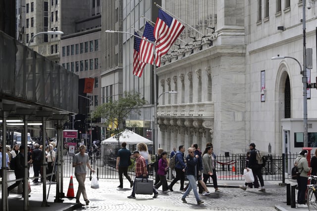 People walking on Wall street