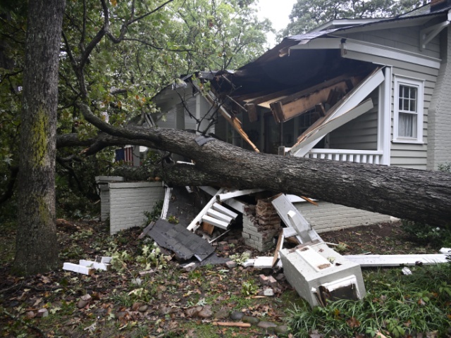CHARLOTTE, USA - SEPTEMBER 27: Trees fall on houses and road after hurricane Helene hits the southeast as bands of the tropical storm pass through the Carolinas causing power outages, school closing and downed trees in Charlotte NC, United States on September 27, 2024 (Photo by Peter Zay/Anadolu via Getty Images)