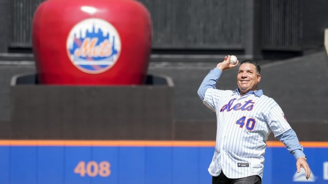 Former New York Mets pitcher Bartolo Colon delivers the ceremonial first pitch before the start of a baseball game between the New York Mets and the Cincinnati Reds, Sunday, Sept. 17, 2023, in New York. (AP Photo/Mary Altaffer)