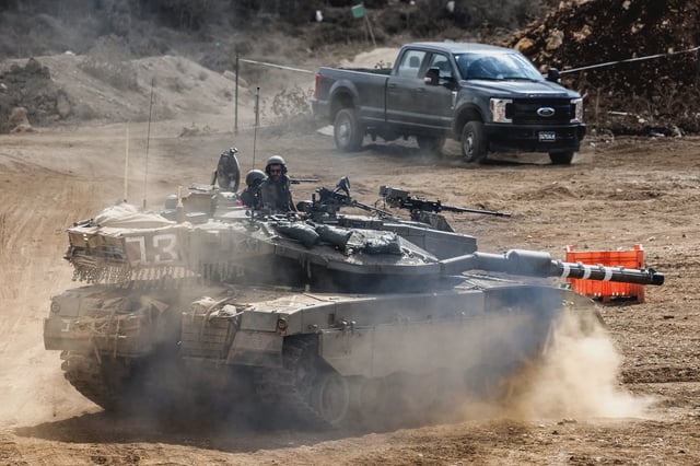 An Israeli army main battle tank moves at a position along the border with Lebanon in northern Israel on Oct. 1.