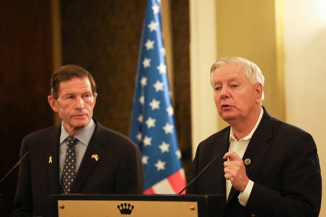 U.S. Senator Lindsey Graham speaks as Richard Blumenthal listens at a press conference in Jerusalem, October 8, 2024. REUTERS/Ronen Zvulun