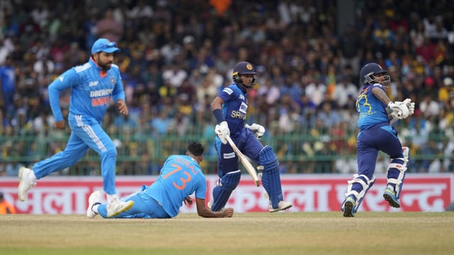 India's Mohammed Siraj loses his balance after delivering a ball as Sri Lanka's Dunith Wellalage and Kusal Mendis run between wickets during the Asia Cup final cricket match between India and Sri Lanka in Colombo, Sri Lanka, Sunday, Sep. 17, 2023. (AP Photo/Eranga Jayawardena)