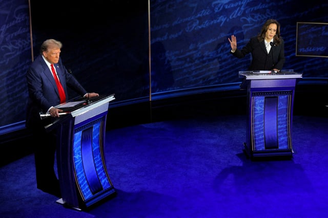 Democratic presidential nominee, U.S. Vice President Kamala Harris, speaks during a presidential debate hosted by ABC as Republican presidential nominee, former U.S. President Donald Trump, listens, in Philadelphia, Pennsylvania, U.S., September 10, 2024. REUTERS/Brian Snyder/File Photo