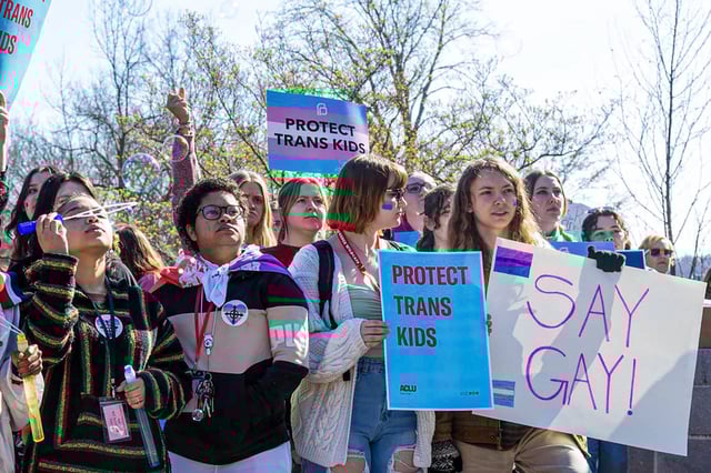 Teens from various areas of Kentucky gather in front of the Kentucky Capitol Annex building on March 29, 2023.