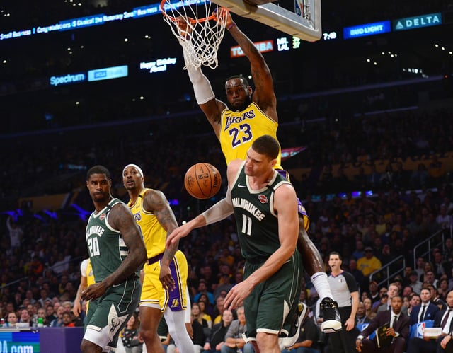 LeBron James dunks on Brook Lopez in early 2020, but the internet was dunking on LeBron after he tweeted exasperation with a preseason flight to Milwaukee for Thursday's preseason game.