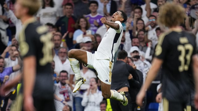 Real Madrid's Jude Bellingham celebrates after scoring his side's first goal during the Champions League group C soccer match between Real Madrid and FC Union Berlin at the Santiago Bernabeu stadium in Madrid, Wednesday, Sept. 20, 2023. (AP Photo/Manu Fernandez)