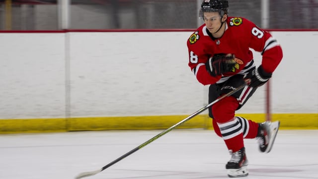 FILE - Chicago Blackhawks hockey player Connor Bedard, the number one overall draft pick, skates on the ice during a photo shoot during the NHL Players Association rookie showcase, Tuesday, Sept. 5, 2023 in Arlington, Va. Bedard is the most hyped hockey player since Connor McDavid. He's just not the only rookie worth watching this NHL season. (AP Photo/Alex Brandon, File)