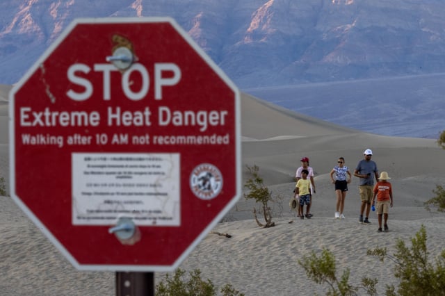 A sign warns of extreme heat danger in Death Valley