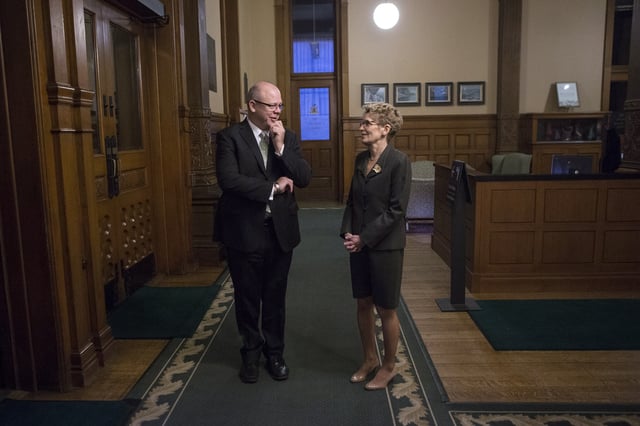 Andrew Bevan talks to then Ontario premier Kathleen Wynne at the Queen's Park Ontario Legislature in Toronto on Friday November 21, 2014. Bevan was appointed as the Liberal Campaign Director by Justin Trudeau. THE CANADIAN PRESS/Chris Young