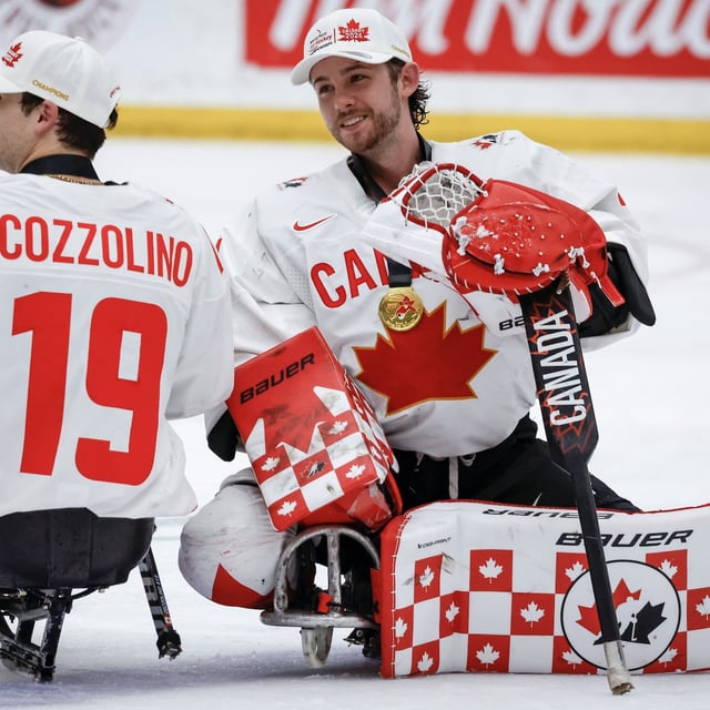 Canada earned a third consecutive silver medal after falling 5-3 to the United States at the International Para Hockey Cup on Sunday. Team Canada goalie Adam Kingsmill (54) and forward Dominic Cozzolino (19) celebrate defeating Team USA to win the World Para Ice Hockey Championship final in Calgary, Sunday, May 12, 2024. THE CANADIAN PRESS/Jeff McIntosh