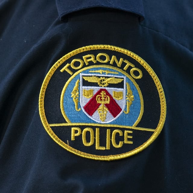 A Toronto Police Service logo patch is shown in Toronto, on Tuesday, Sept. 5, 2023. Toronto police say two suspects shot at a Jewish girls school early Saturday morning and damaged the building. THE CANADIAN PRESS/Spencer Colby