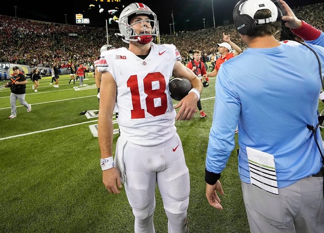 Ohio State quarterback Will Howard (18) walks off the field after the Buckeyes fell to Oregon 32-31 at Autzen Stadium.