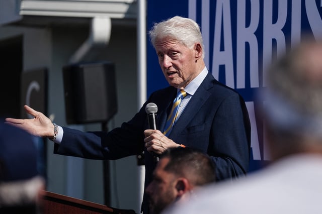 Former President Bill Clinton speaks on behalf of the Harris/Walz campaign outside a Democratic campaign office in Columbus, Ga., on Monday, Oct. 14, 2024.