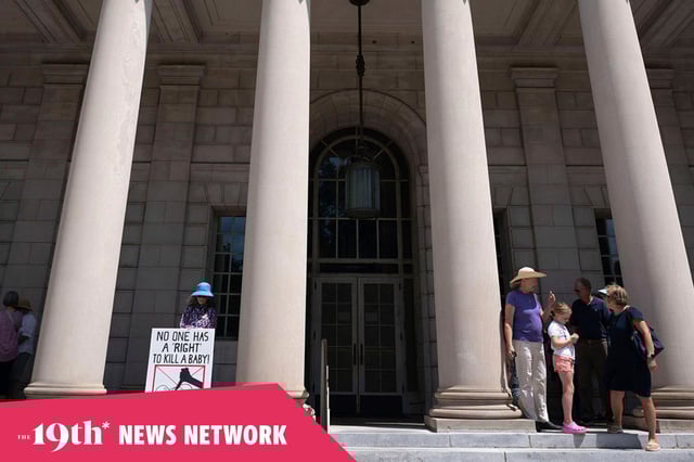 Demonstrators pray outside the South Carolina Supreme Court in anticipation of hearings on a recently passed abortion law in June 2023.