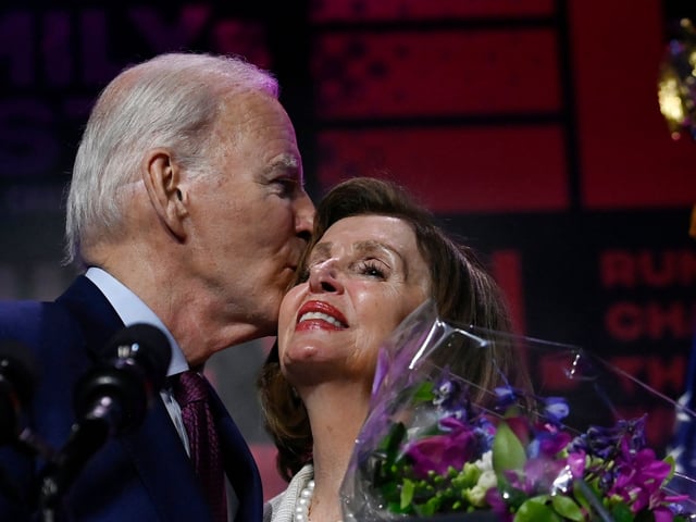 US President Joe Biden kisses honoree House Speaker Emerita Nancy Pelosi onstage during Emily's List annual We Are Emily National Gala at The Anthem in Washington, DC, May 16, 2023. This year House Speaker Emerita Nancy Pelosi is being honored along with a celebration of Democratic pro-choice women bringing change to their communities and the world in elected office, and future elected women who will secure and restore women's rights. (Photo by OLIVIER DOULIERY / AFP) (Photo by OLIVIER DOULIERY/AFP via Getty Images)