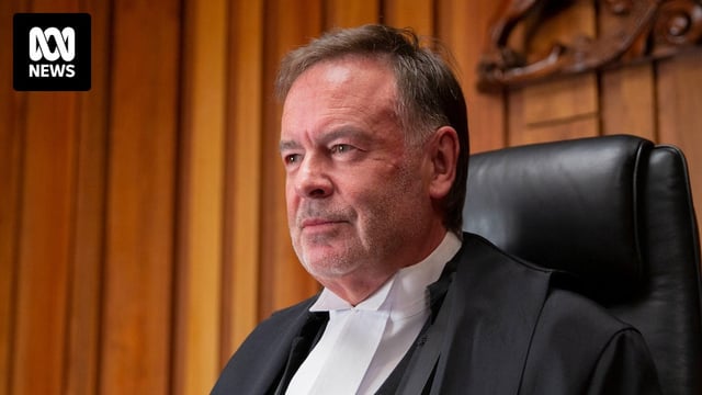Justice Gregory Geason looks off camera.