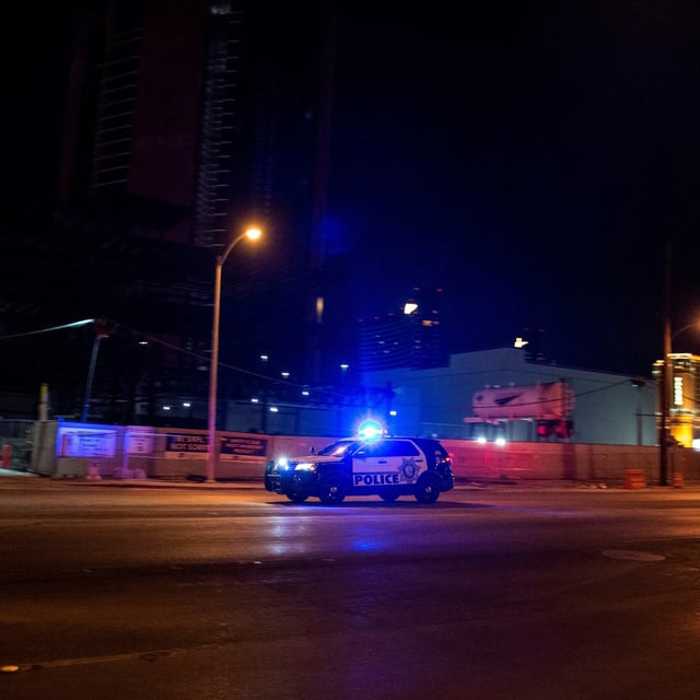 A police car makes its way to the scene after a shooting was reported outside Circus Circus hotel in Las Vegas. Five teenage girls have been arrested on charges of murdering a man with disabilities in Washington D.C.