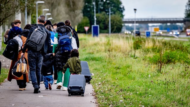 Asylum seekers near the Ter Apel registration centre, where most migrants report after arriving in the Netherlands