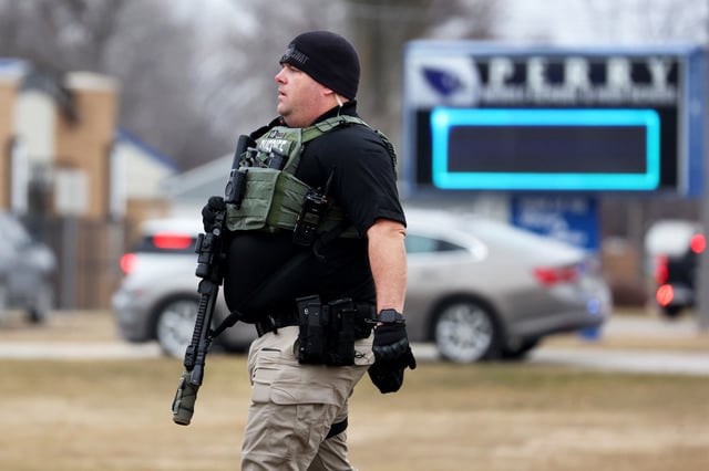 Police respond to a school shooting at the Perry Middle School and High School complex in Perry, Iowa, on Jan. 4, 2024. 