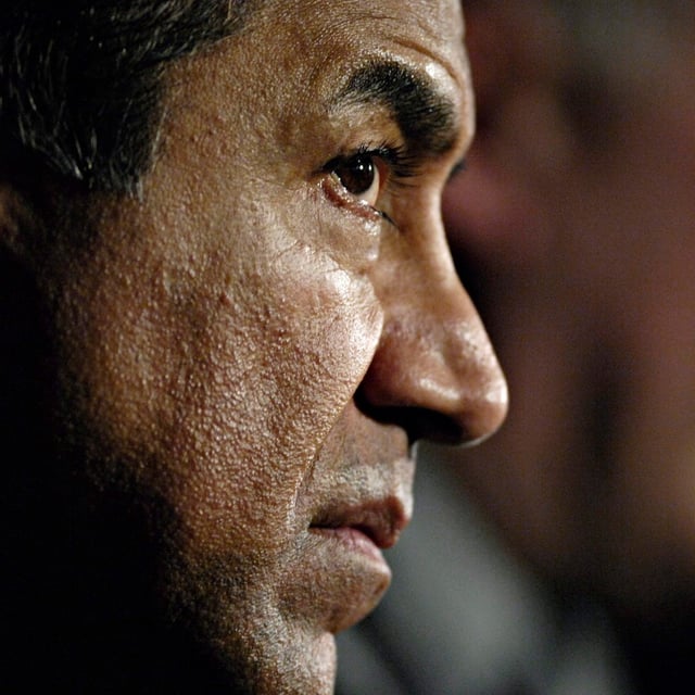 Former B.C. Solicitor General Kash Heed listens as RCMP Cpl. Dan Moskaluk speaks at a press conference in Revelstoke, B.C. on Sunday, March 14, 2010. Alleged members of an Indian gang and its leader have been sending shivers down the spines of members of the South Asian diaspora in Canada for years, says councillor Kash Heed in Richmond, B.C. THE CANADIAN PRESS/Daniel Hayduk