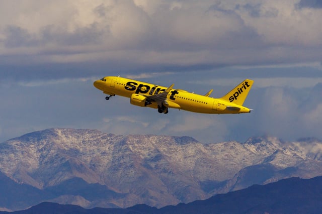 A Spirit Airlines commercial airliner flies after taking off from Las Vegas International Airport in Las Vegas, Nevada, U.S., February 8, 2024.  REUTERS/Mike Blake/File Photo