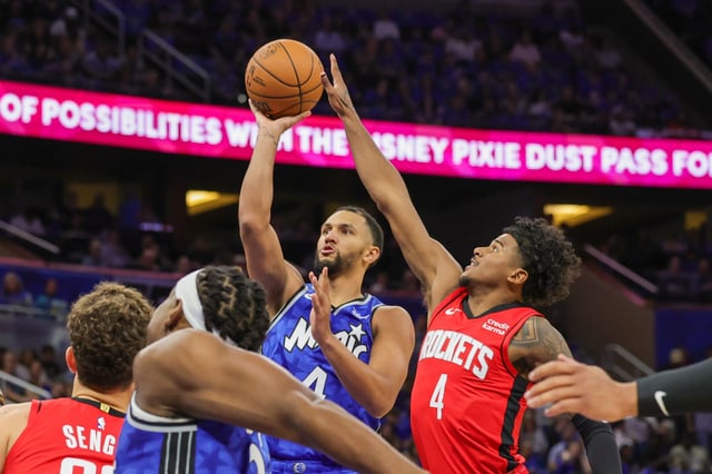 Oct 25, 2023; Orlando, Florida, USA; Orlando Magic guard Jalen Suggs (4) shoots the ball in front of Houston Rockets guard Jalen Green (4) during the first quarter at Amway Center.