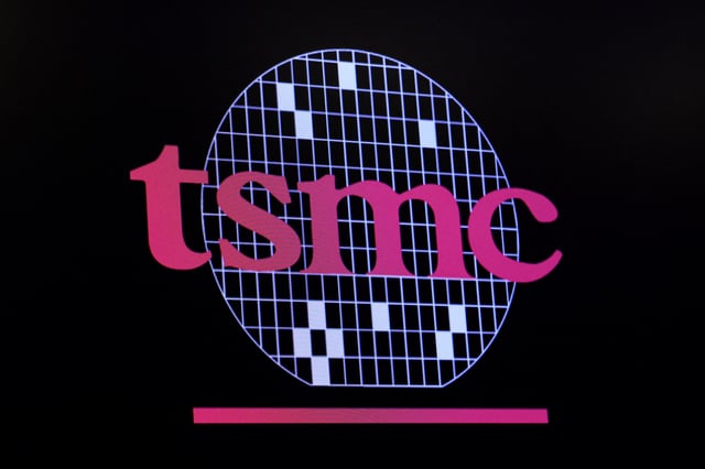 The company logo for Taiwan Semiconductor Manufacturing Company is displayed on a screen on the floor of the New York Stock Exchange (NYSE) in New York City, U.S., September 26, 2023.  REUTERS/Brendan McDermid/File Photo