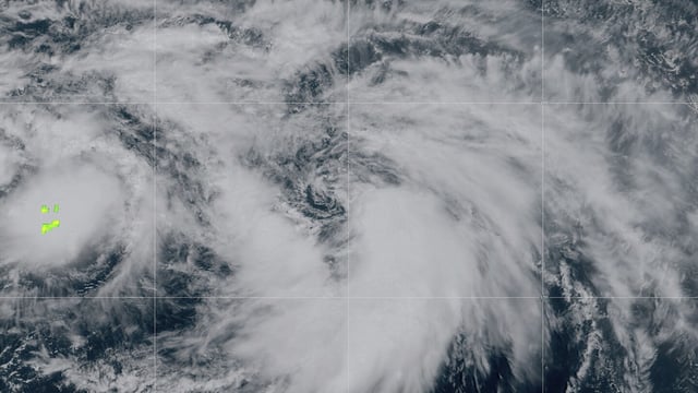 This satellite image provided by NOAA on 11:11 am EST Thursday, Sept. 28, 2023 shows Tropical Storm Rina forming in the Atlantic Ocean. Rina had maximum sustained winds of 40 mph (65 kph) and was centered 1,190 miles (1,915 kilometers) east of the Northern Leeward Islands. No coastal watches or warnings are in effect for the storm, and there were no hazards affecting land. (NOAA via AP)