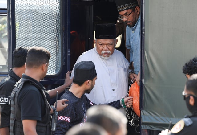 CEO of Global Ikhwan Services and Business Holdings (GISB) Nasiruddin Mohd Ali disembarks from a police truck upon arriving at the Selayang court to face charges, in Selayang, Malaysia. October 23, 2024. REUTERS/Hasnoor Hussain
