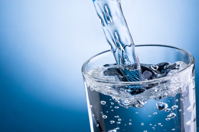 Pouring water into glass