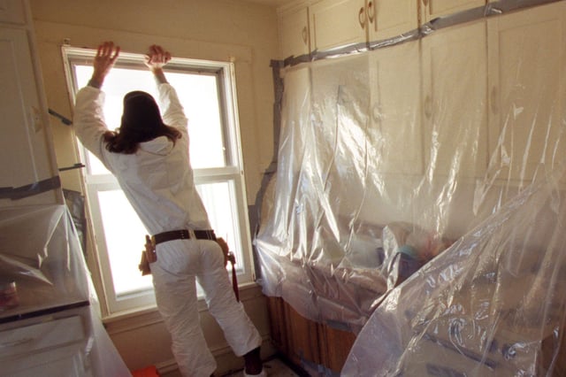 St. Paul, MN., Wednesday, 3/29/2000.  Aaron Wenger of South Minneapolis, a CLEARCorps lead removal crew member installed weather strip on new windows in a house near downtown St. Paul.  Twelve windows in the house were removed and replaced as part of the effort to reduce the risk of childhood lead poisioning.  Plastic sheeting was taped up in the kitchen to contain any dust from the lead cleanup job.  CLEARCorps is a nonprofit lead removal company, part of the AmeriCorps national service network. LEAD31  All children up to age 6 living in Minneapolis and St. Paul should be tested for exposure to lead, state officials are expected to recommend Friday3/31. This is a departure from previous recommendations, which focused on children living in older homesthat have lead-based paint. Public health officials aremaking the change in an attempt to simplify the guidelines _ there's concern that too many children aren't being tested. There is little evidence at this point that lead poisoning is getting worse. In Minneapolis, about 10 percent of children who are tested have elevated levels of lead in their blood.(Photo By BRUCE BISPING/Star Tribune via Getty Images)