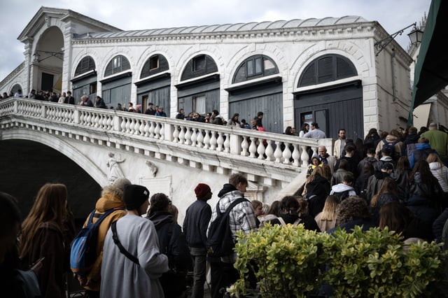 Venice faces a continual onslaught of tourists as its population declines.