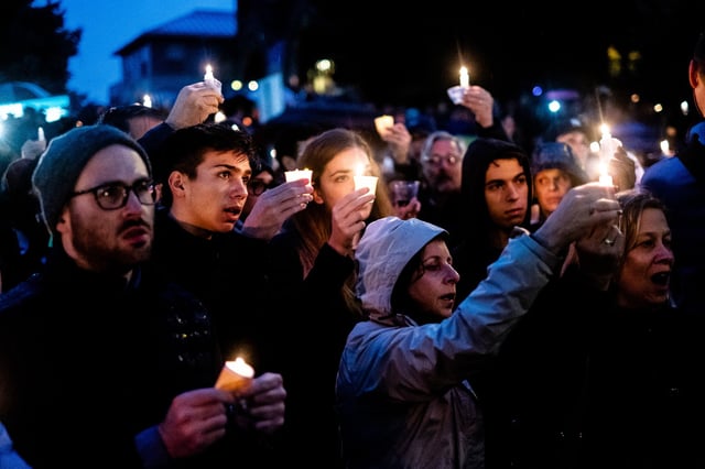 People attend a vigil after a mass shooting at the Tree of Life Synagogue in Squirrel Hill, Pittsburgh, Pa., on Oct. 27, 2018.