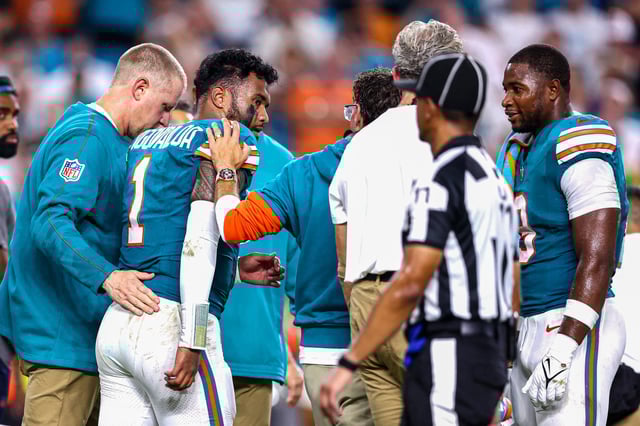 Tua Tagovailoa of the Miami Dolphins walks off the field after play on the field against the Buffalo Bills on Sept. 12 in Miami Gardens, Fla.