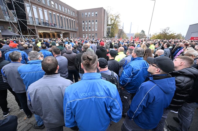 Volkswagen employees gather to hear from the automaker's works council at the company's headquarters in Wolfsburg, Germany on October 28, 2024.