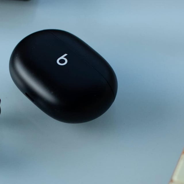 A pair of Beats Studio Buds on a table
