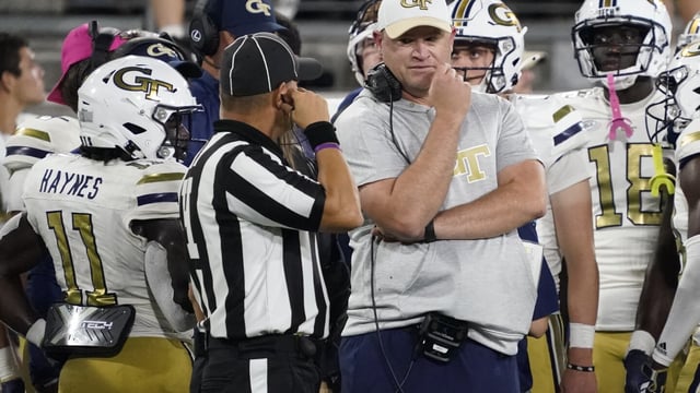 Georgia Tech coach Brent Key, right, talks with an official during the second half of the team's NCAA college football game against Wake Forest in Winston-Salem, N.C., Saturday, Sept. 23, 2023. (AP Photo/Chuck Burton)