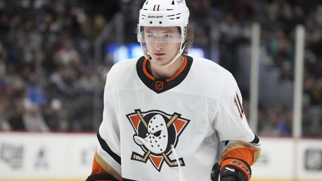 FILE - Anaheim Ducks' Trevor Zegras (11) plays in the second period of an NHL hockey game Thursday, Jan. 26, 2023, in Denver. Ducks forward Trevor Zegras is one of several restricted free agents without a contract for the upcoming NHL season. Zegras was the team's leading scorer last season with 65 points. (AP Photo/David Zalubowski, File)