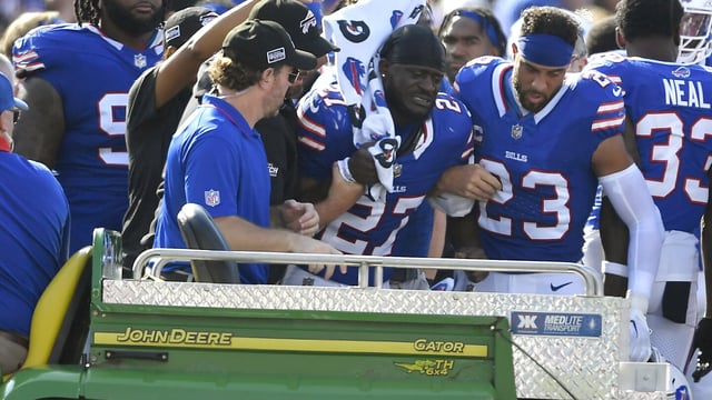 Buffalo Bills cornerback Tre'Davious White (27), center, is assisted onto the back of a cart after sustaining an injury during the second half an NFL football game against the Miami Dolphins, Sunday, Oct. 1, 2023, in Orchard Park, N.Y. (AP Photo/Adrian Kraus)